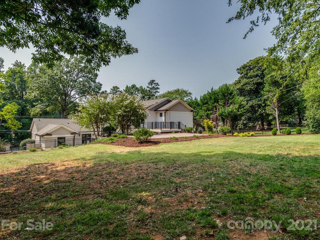 5923 Sharon View Road Charlotte, NC 28226 - Photo 39 of 44 a view of yard with swimming pool and green space