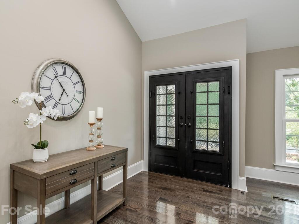 5923 Sharon View Road Charlotte, NC 28226 - Photo 4 of 44 a view of a hallway with entryway windows and cabinet