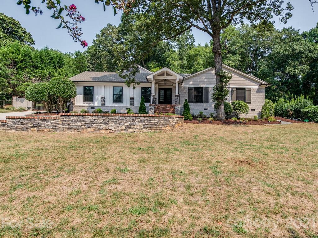 5923 Sharon View Road Charlotte, NC 28226 - Photo 43 of 44 a front view of a house with a yard