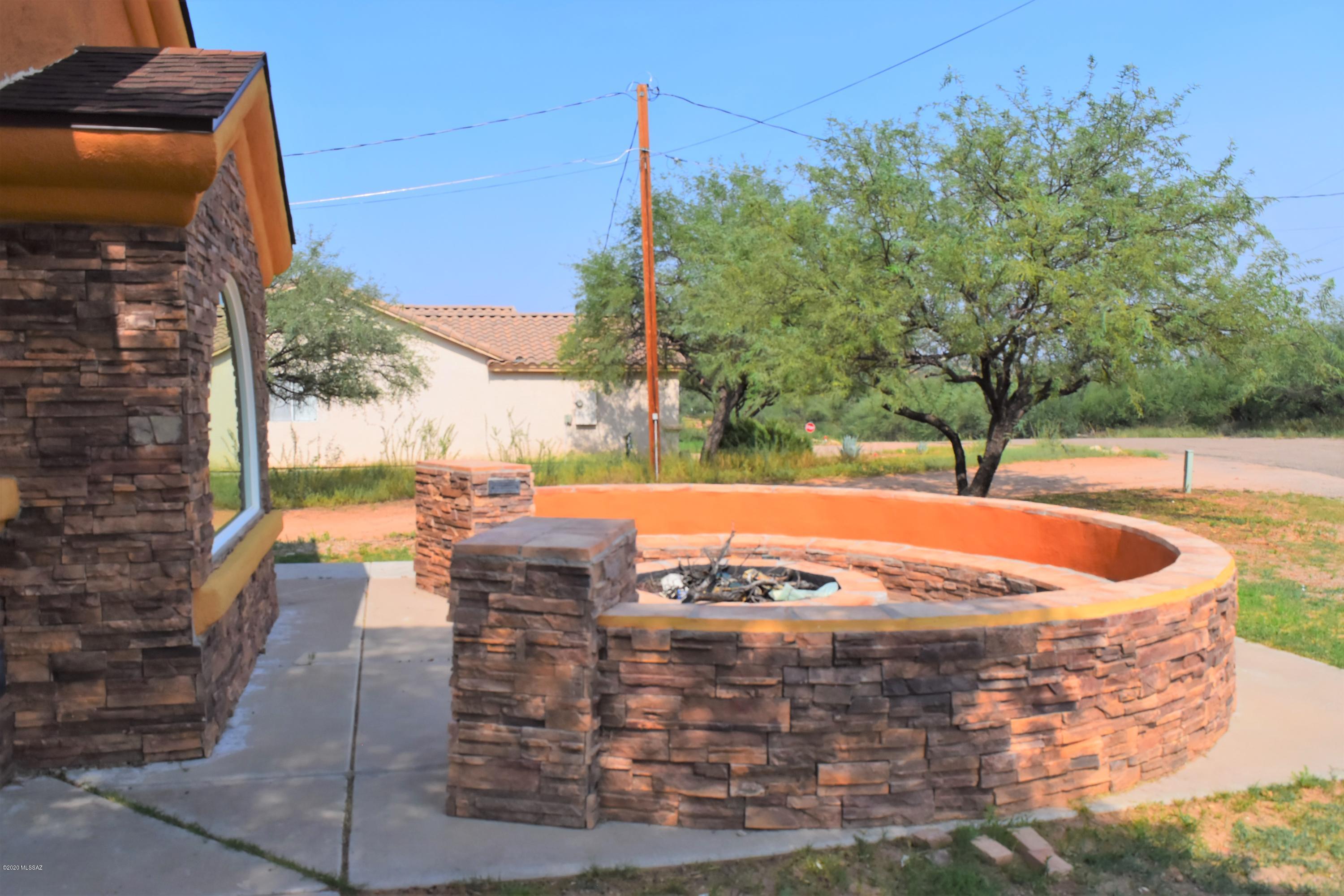 146 Nee Court Rio Rico, AZ 85648 - Photo 2 of 13 a view of a swimming pool with a patio
