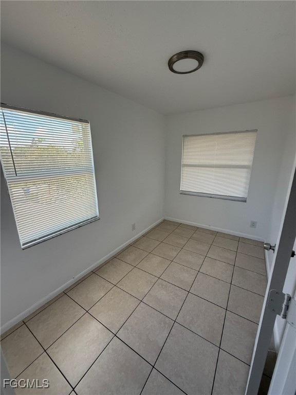 11431 Char Ann Drive, Unit 5 Fort Myers, FL 33908 - Photo 1 of 14 a view of an empty room and a window