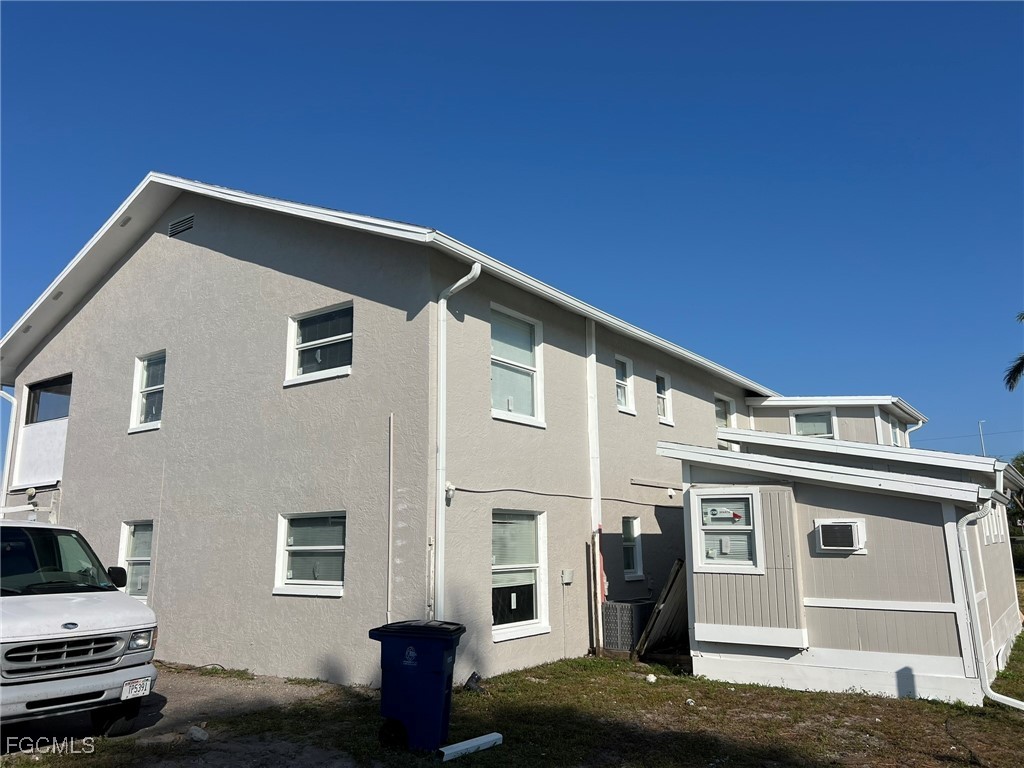 11431 Char Ann Drive, Unit 5 Fort Myers, FL 33908 - Photo 14 of 14 a front view of a house with a garage