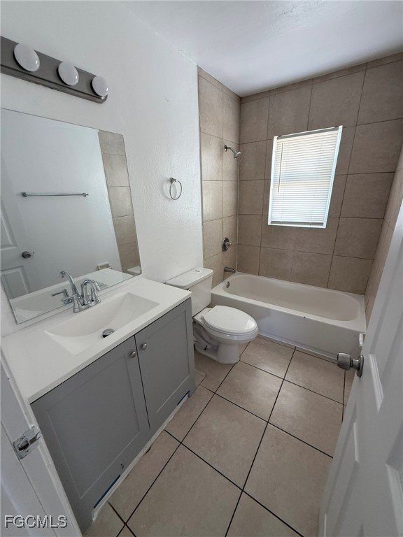 11431 Char Ann Drive, Unit 5 Fort Myers, FL 33908 - Photo 9 of 14 a bathroom with a sink toilet and mirror