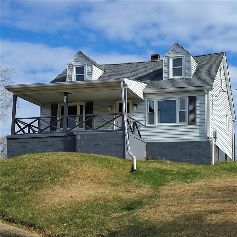 84 Crossridge Road Charleroi, PA 15022 - Photo 1 of 35 a front view of a house with garden