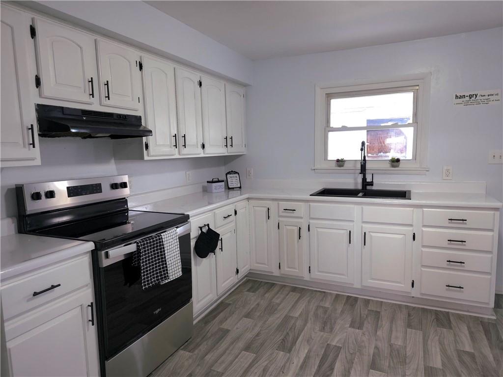 84 Crossridge Road Charleroi, PA 15022 - Photo 14 of 35 a kitchen with granite countertop white cabinets and white appliances