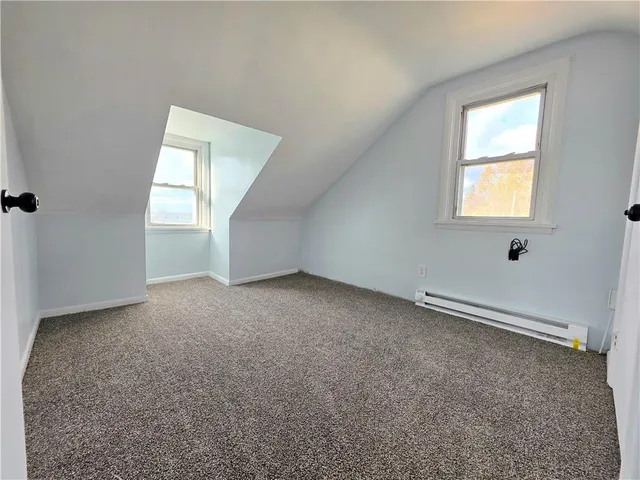 a view of an empty room with windows