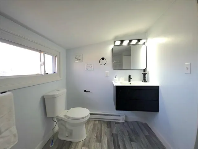 a bathroom with a toilet and a bathtub