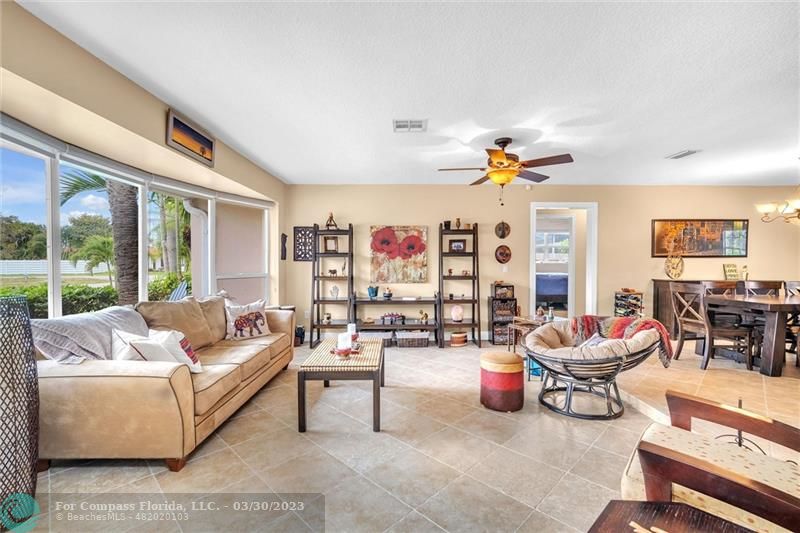 5206 Cleveland Street Hollywood, FL 33021 - Photo 13 of 49 a living room with furniture and a large window