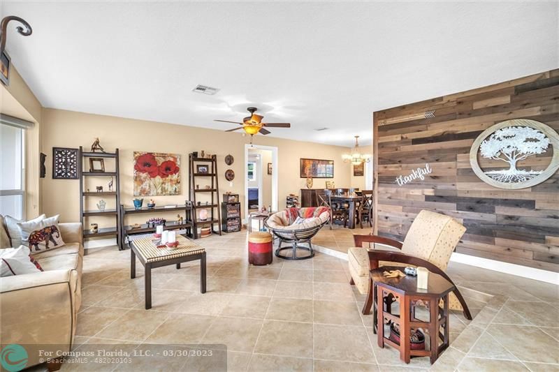 5206 Cleveland Street Hollywood, FL 33021 - Photo 14 of 49 a living room with furniture and a table