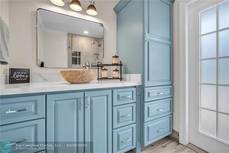 5206 Cleveland Street Hollywood, FL 33021 - Photo 18 of 49 a view of counter top space and mirrors