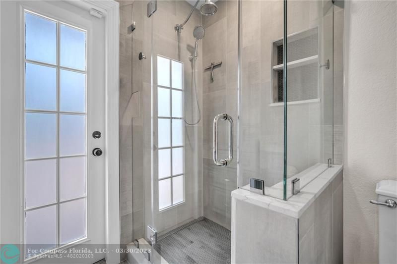 5206 Cleveland Street Hollywood, FL 33021 - Photo 19 of 49 a bathroom with a shower and a sink