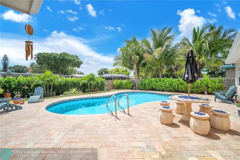 5206 Cleveland Street Hollywood, FL 33021 - Photo 2 of 49 a view of a swimming pool with a patio