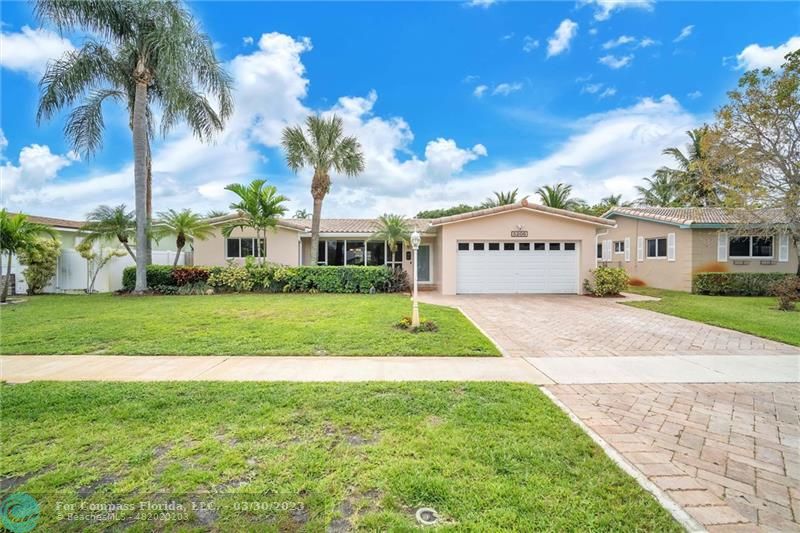 5206 Cleveland Street Hollywood, FL 33021 - Photo 3 of 49 a view of house with yard and green space