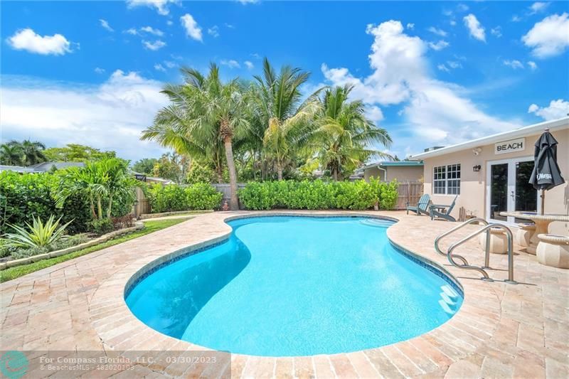 5206 Cleveland Street Hollywood, FL 33021 - Photo 35 of 49 a view of a swimming pool with a yard