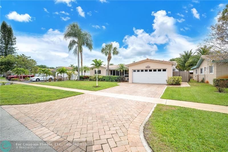 5206 Cleveland Street Hollywood, FL 33021 - Photo 48 of 49 a view of building with garden