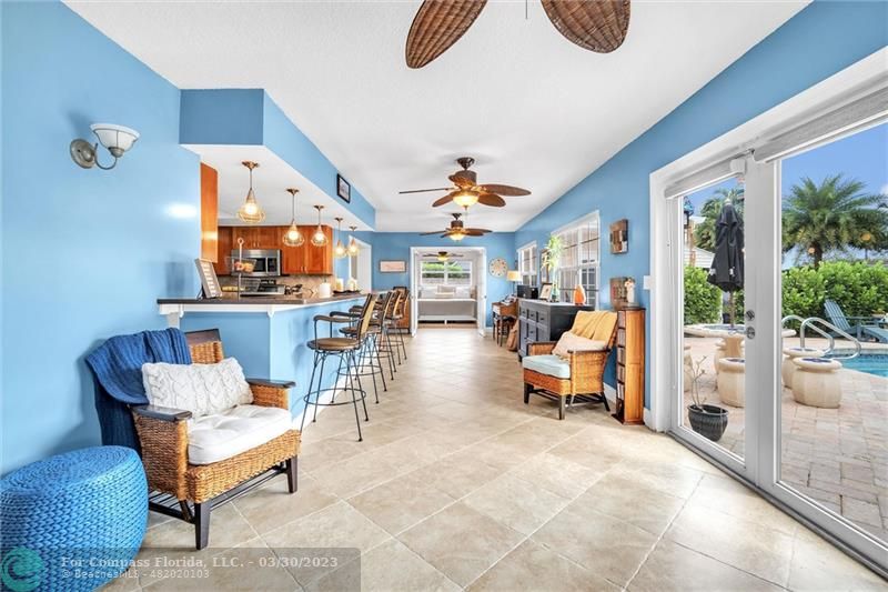 5206 Cleveland Street Hollywood, FL 33021 - Photo 9 of 49 a living room with furniture a rug and a large window