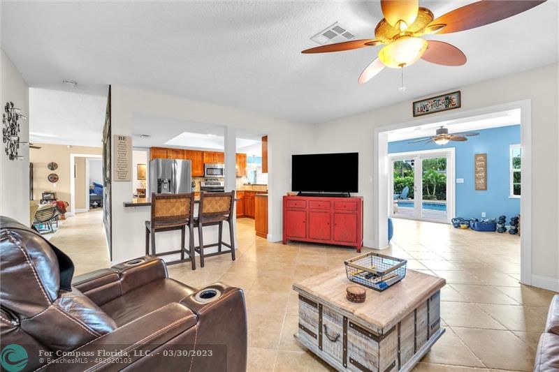 5206 Cleveland Street Hollywood, FL 33021 - Photo 10 of 49 a living room with furniture and a flat screen tv