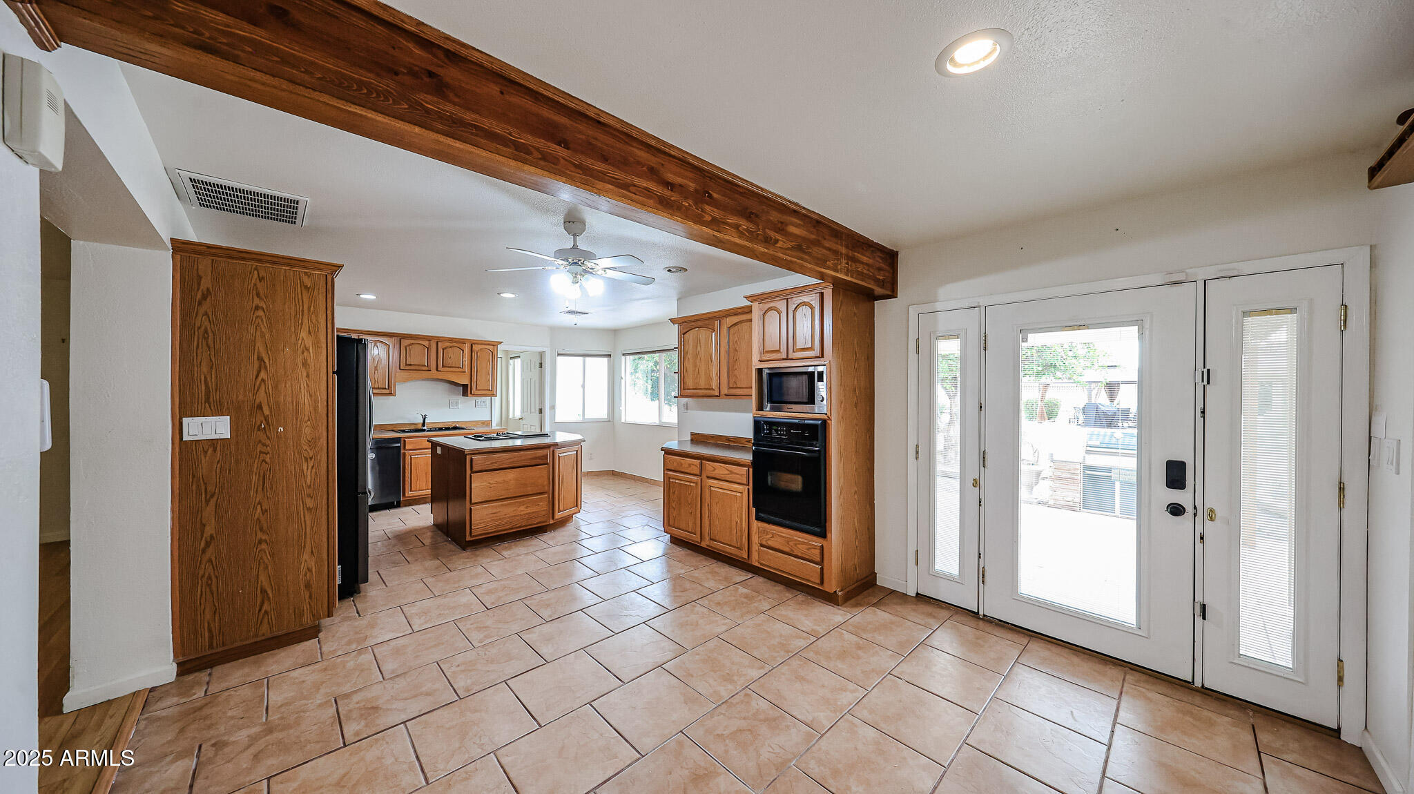 11851 North Thunderbird Road Sun City, AZ 85351 - Photo 13 of 46 a kitchen with stainless steel appliances granite countertop a refrigerator and a sink