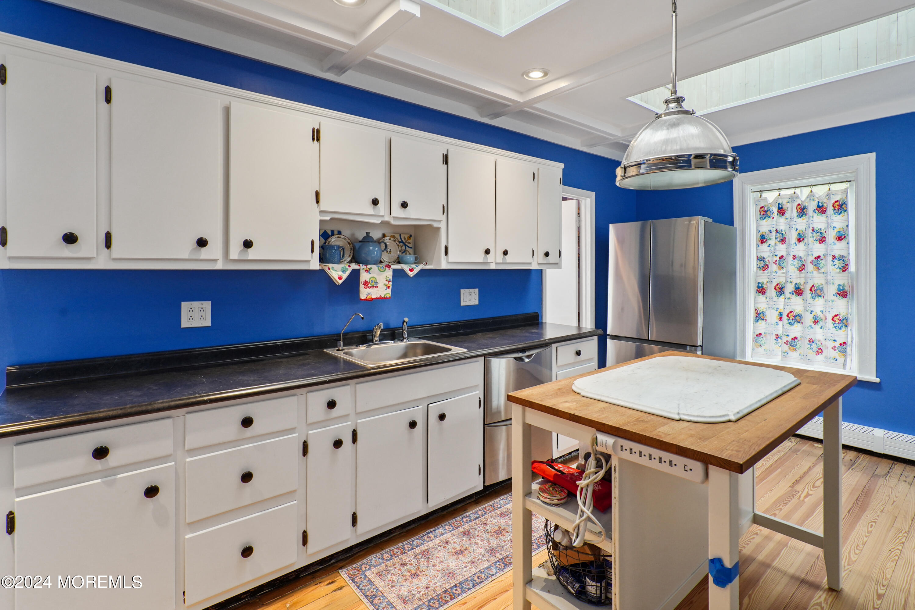 1719 Beverly Avenue Spring Lake Heights, NJ 07762 - Photo 14 of 21 a kitchen with stainless steel appliances granite countertop a sink dishwasher and a refrigerator with wooden cabinets