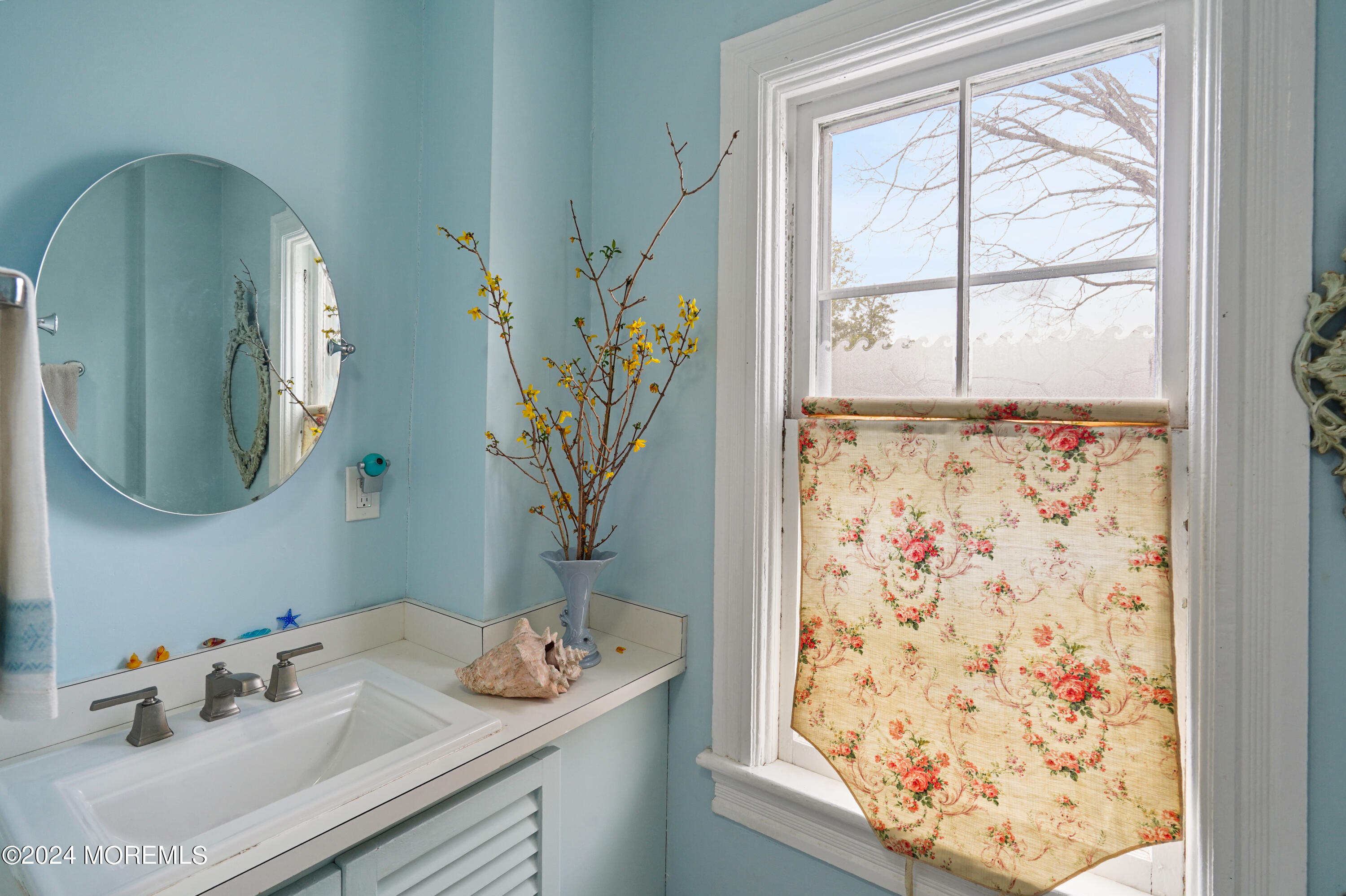 1719 Beverly Avenue Spring Lake Heights, NJ 07762 - Photo 18 of 21 a bathroom with a sink and a mirror