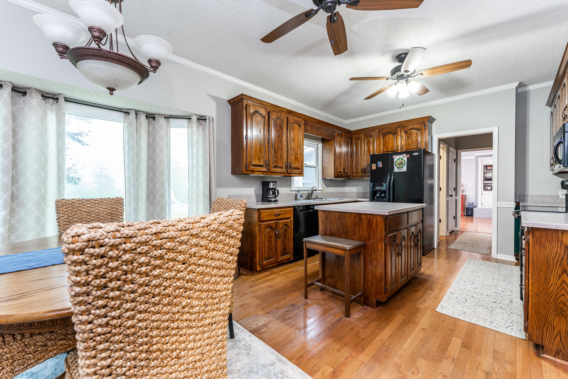 6240 Stapleton Road Macon, GA 31206 - Photo 14 of 28 a living room with kitchen island granite countertop furniture and a ceiling fan