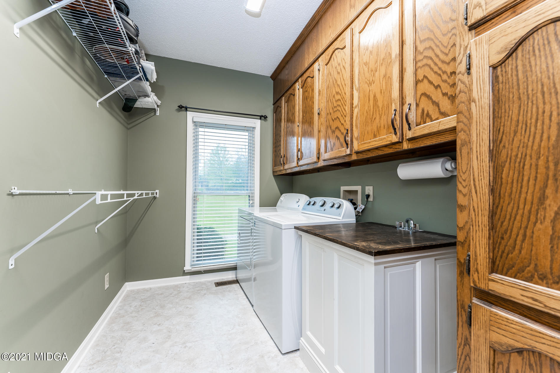 6240 Stapleton Road Macon, GA 31206 - Photo 22 of 28 a utility room with a sink a washer and dryer