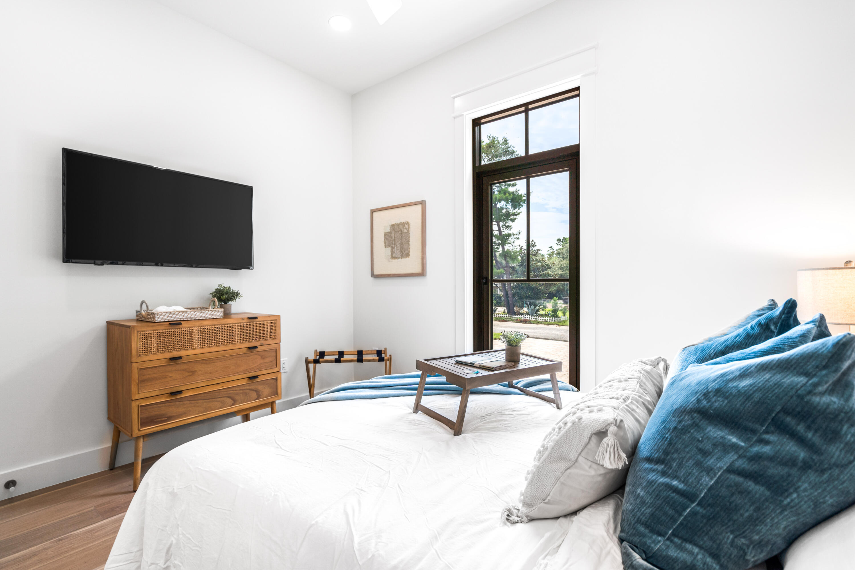 53 Porpoise Street Santa Rosa Beach, FL 32459 - Photo 26 of 75 a spacious bedroom with a bed and a flat screen tv