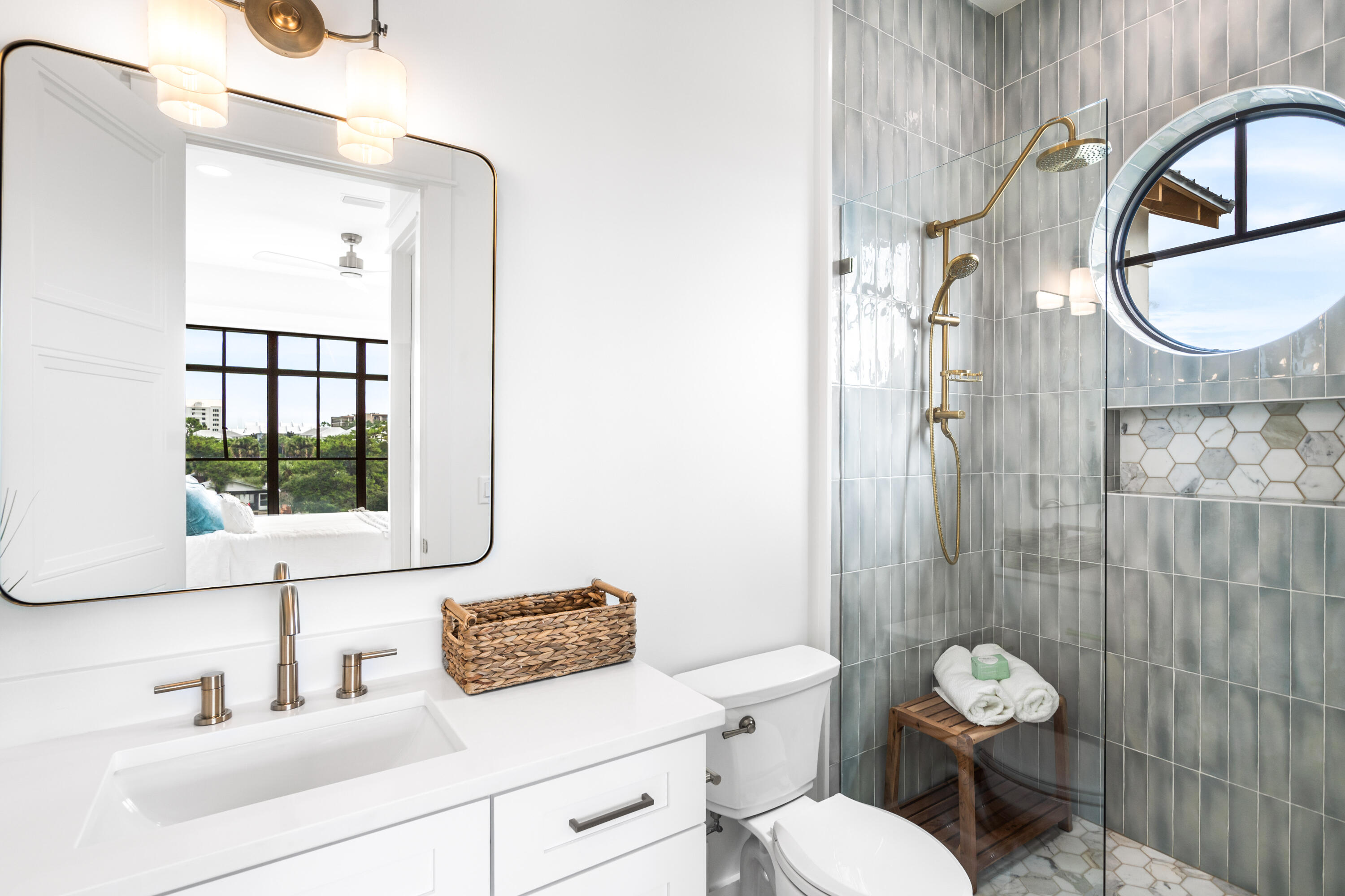 53 Porpoise Street Santa Rosa Beach, FL 32459 - Photo 59 of 75 a bathroom with a toilet a sink and a mirror