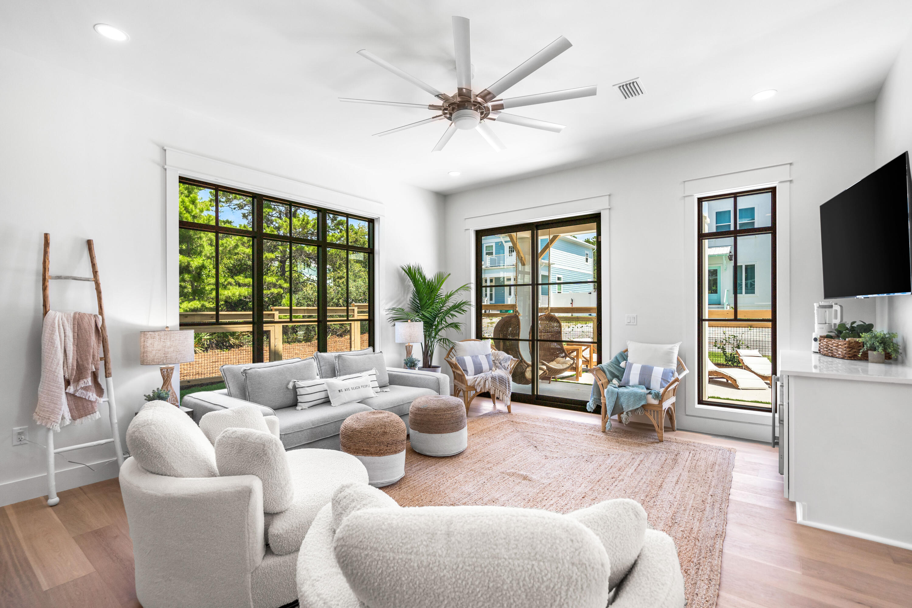 53 Porpoise Street Santa Rosa Beach, FL 32459 - Photo 8 of 75 a living room with furniture large windows and wooden floor