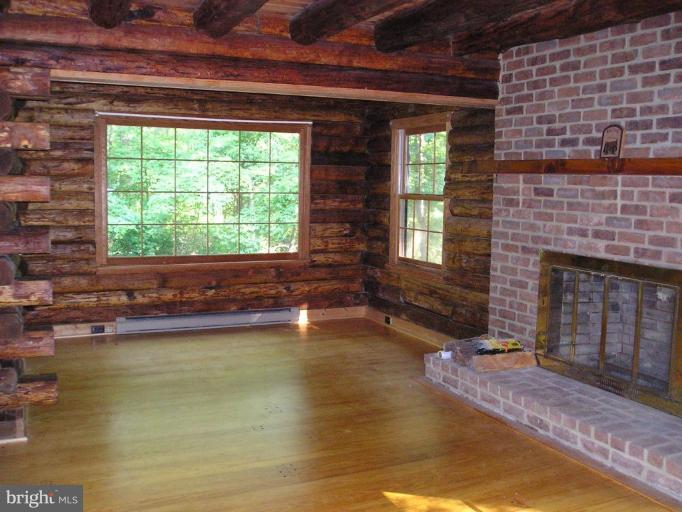 26720 Arcadia Shores Road Easton, MD 21601 - Photo 5 of 24 Living Room/brick fireplace