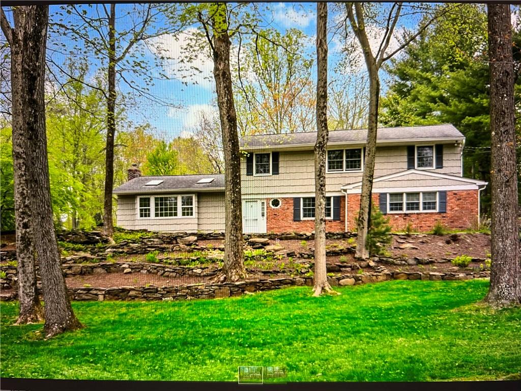 15 Saddle Ridge Road Ossining, NY 10562 - Photo 1 of 1 front view of a house with a yard