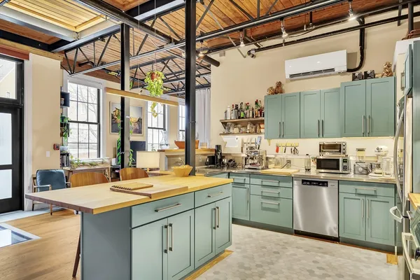a kitchen with a sink and stove