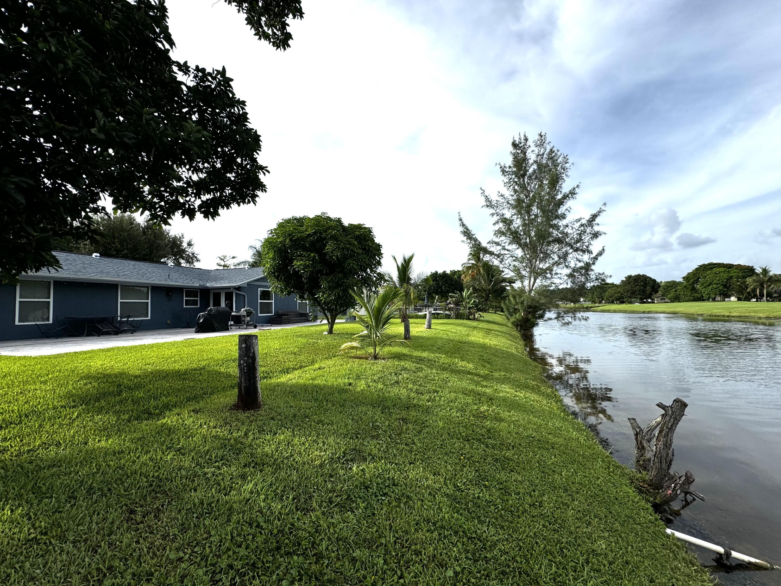 116 Park Road North Royal Palm Beach, FL 33411 - Photo 3 of 20 Canal views