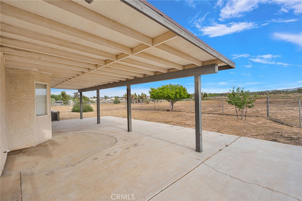 6271 Smoke Tree Road Phelan, CA 92371 - Photo 14 of 28 Back patio with gated yard