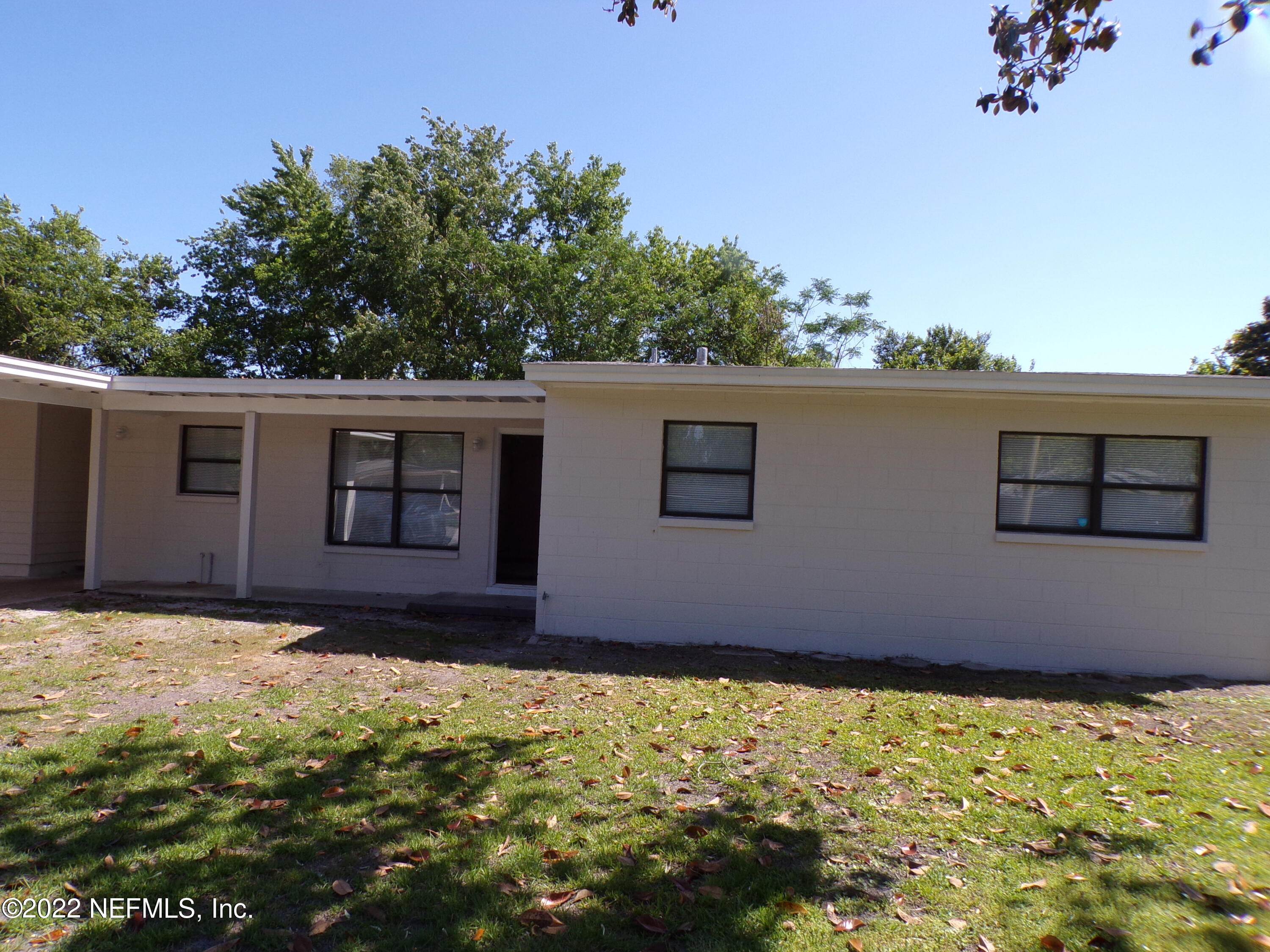 7424 Strato Road Jacksonville, FL 32210 - Photo 1 of 16 a house with a yard