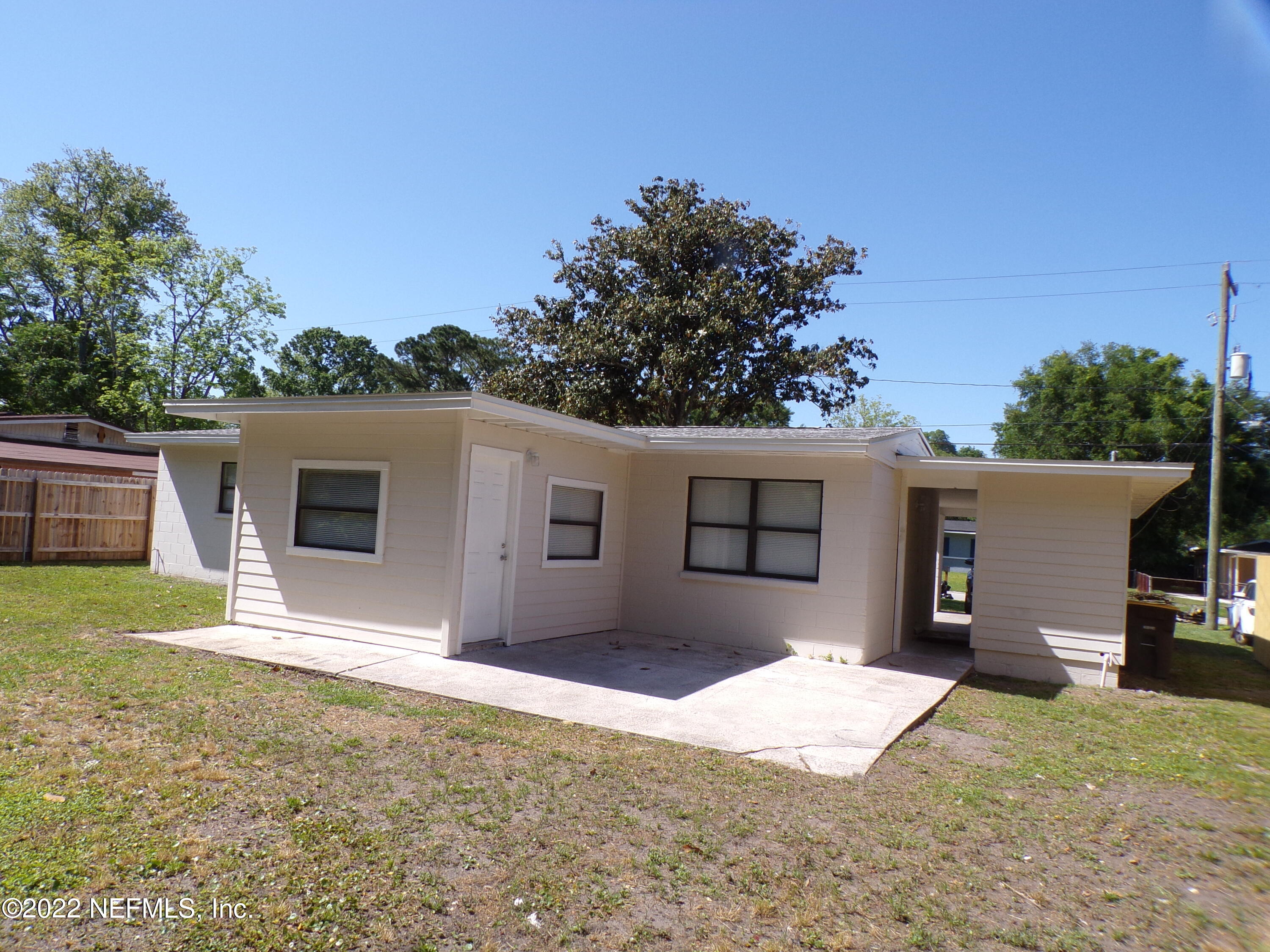 7424 Strato Road Jacksonville, FL 32210 - Photo 2 of 16 a house with trees in the background