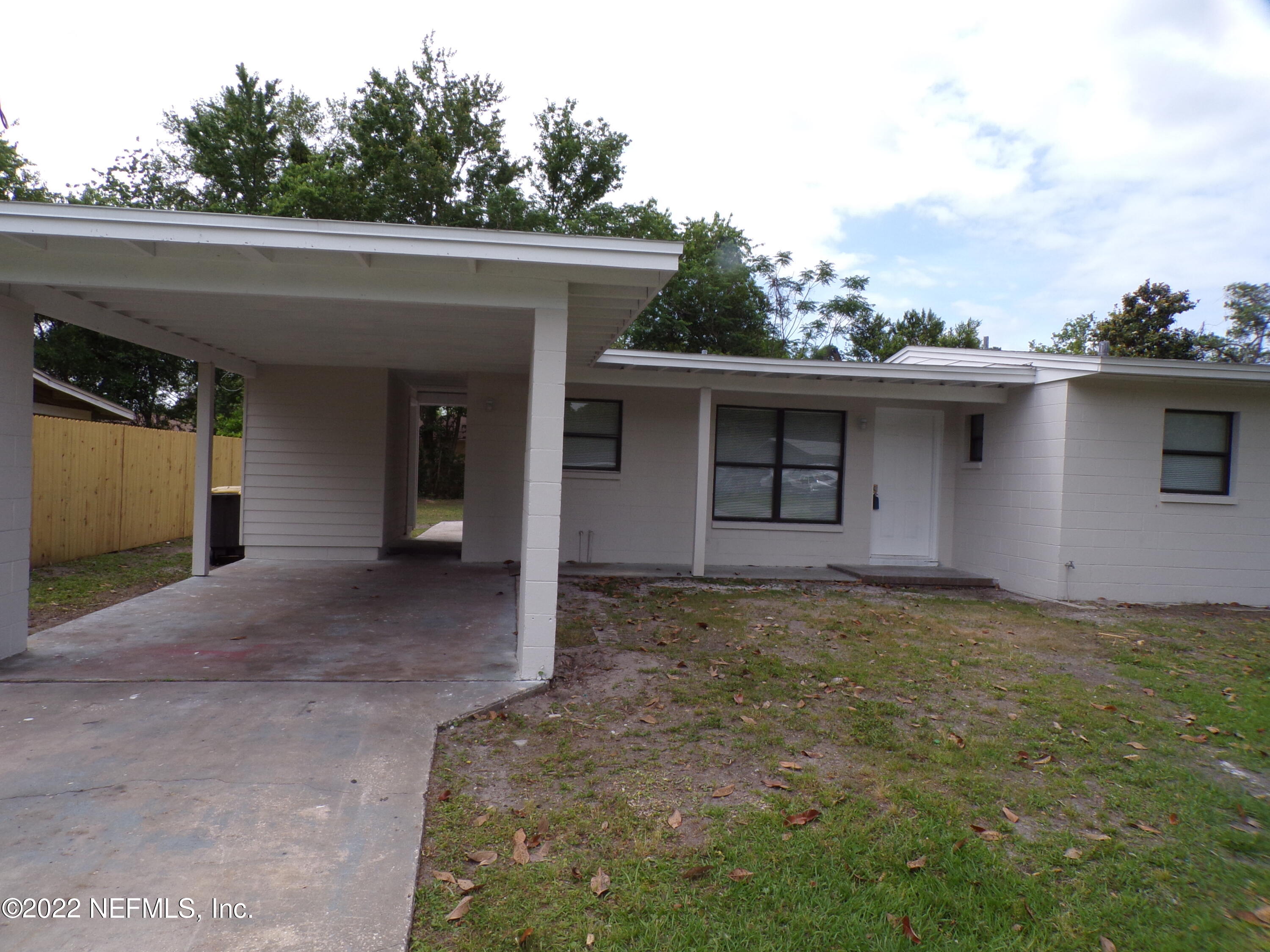 7424 Strato Road Jacksonville, FL 32210 - Photo 3 of 16 a view of a house with a outdoor space