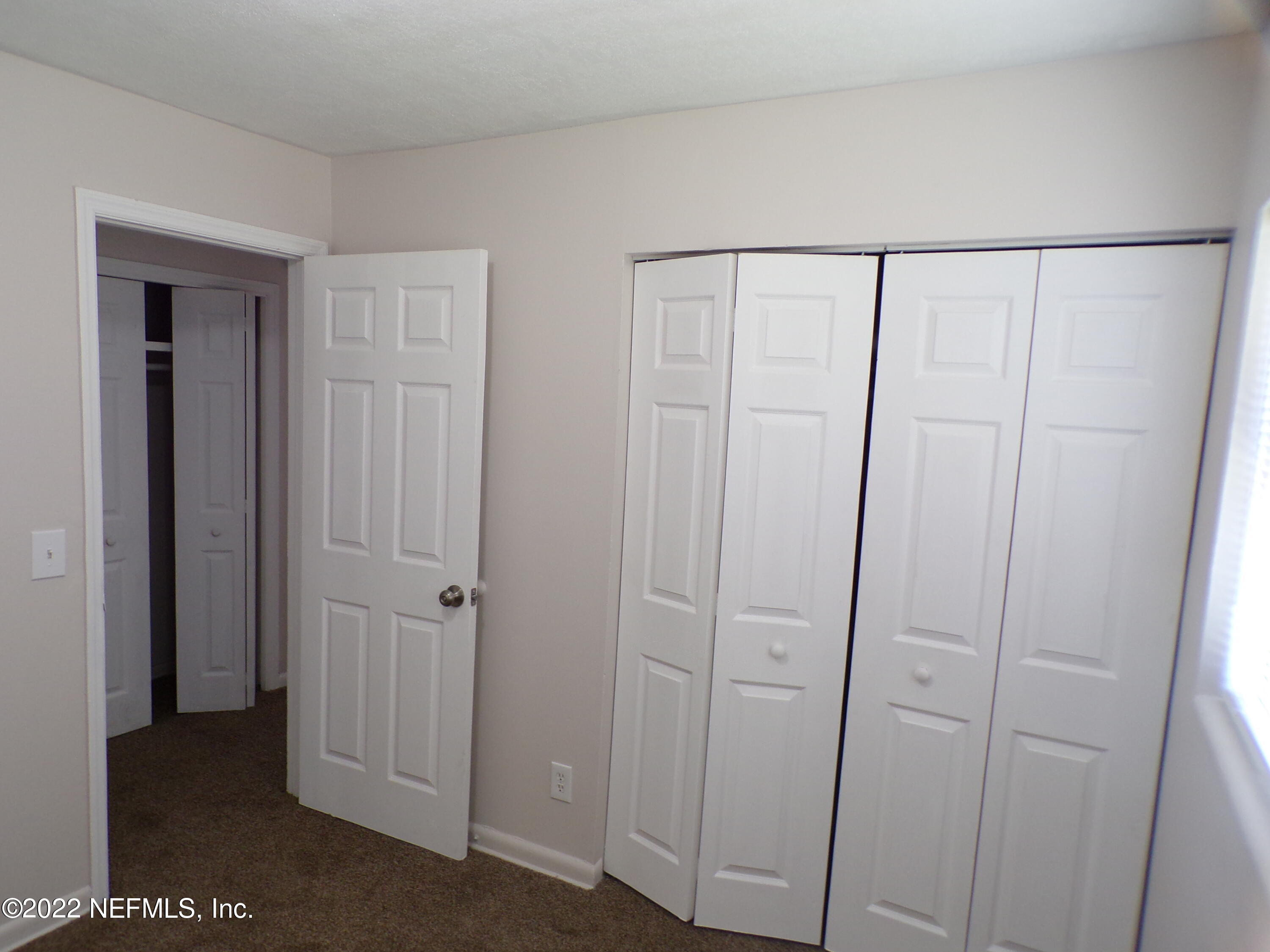 7424 Strato Road Jacksonville, FL 32210 - Photo 10 of 16 a view of a closet area
