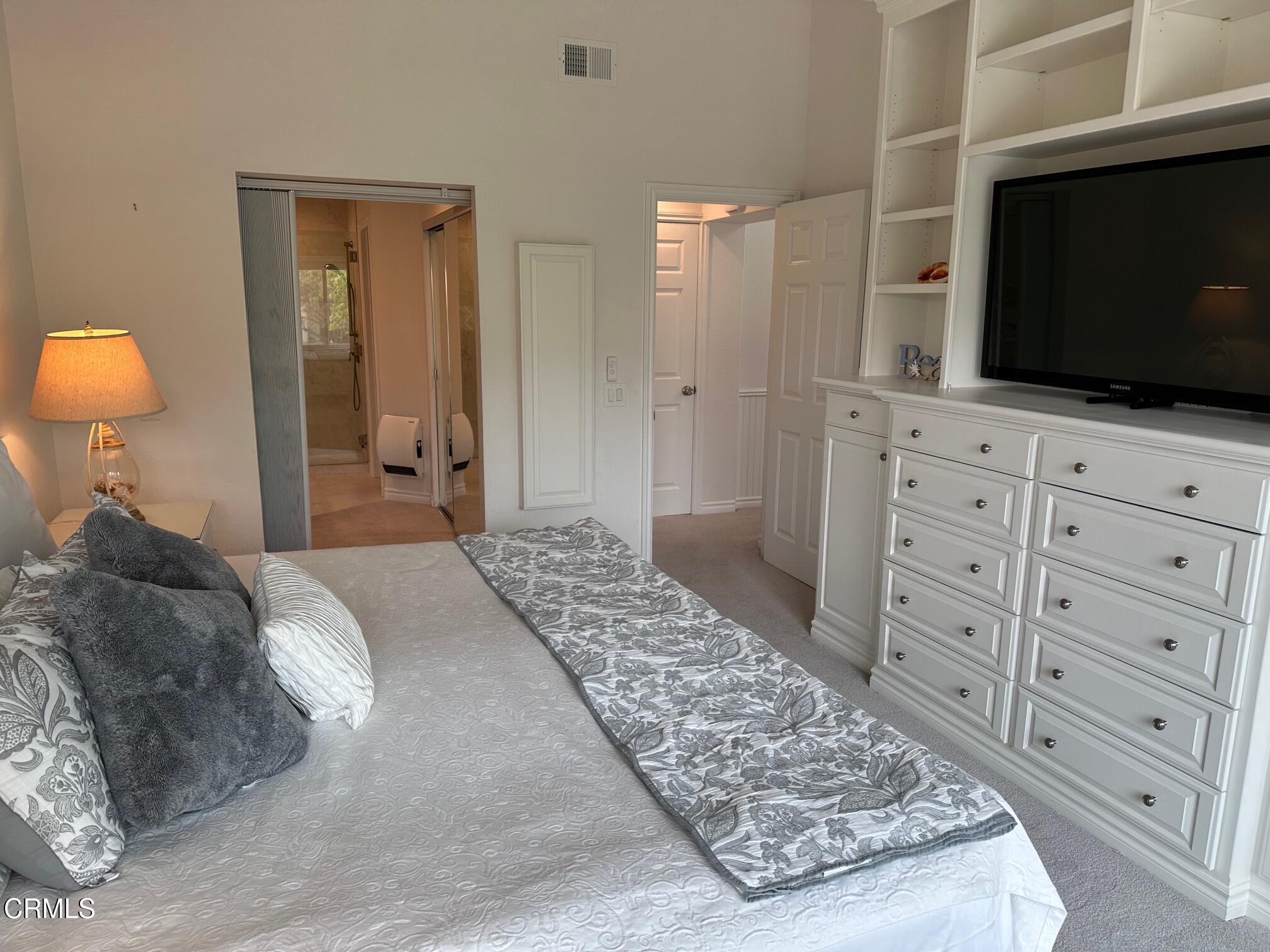 1941 Majorca Drive Oxnard, CA 93035 - Photo 20 of 39 a bedroom with a bed and a flat screen tv