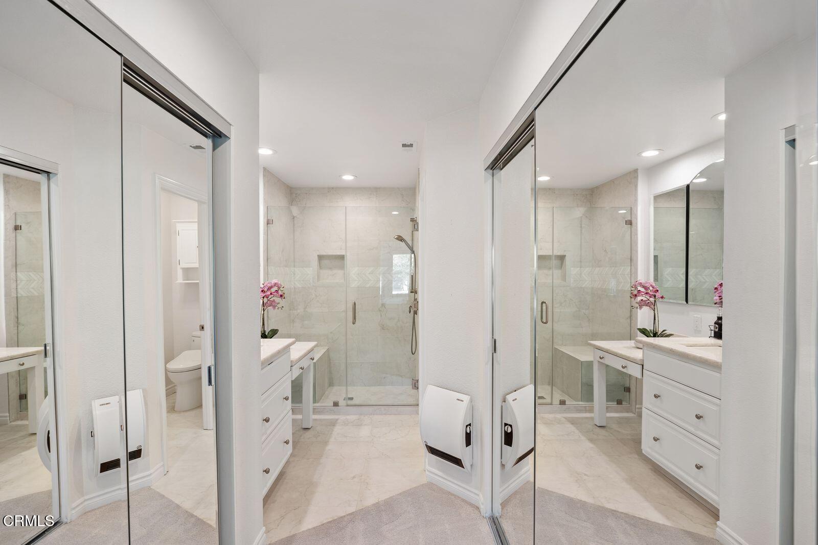 1941 Majorca Drive Oxnard, CA 93035 - Photo 21 of 39 a bathroom with a glass door shower a sink and a mirror