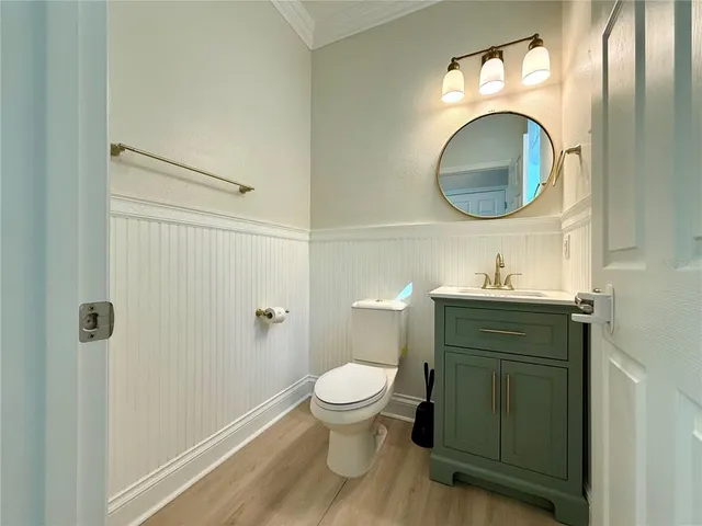 a bathroom with a granite countertop shower and a toilet