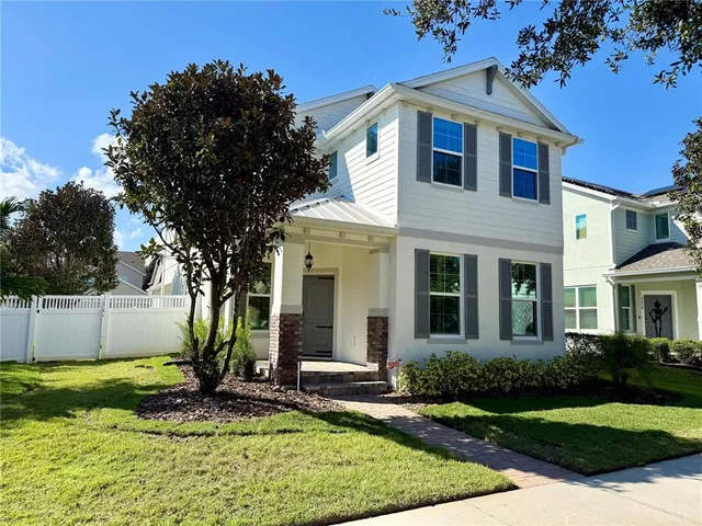 a kitchen with stainless steel appliances kitchen island granite countertop a sink stove and refrigerator