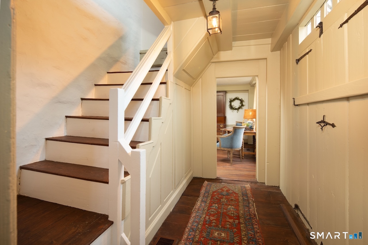 3 Studio Hill Road Kent, CT 06757 - Photo 7 of 33 a view of a hallway with wooden floor and staircase