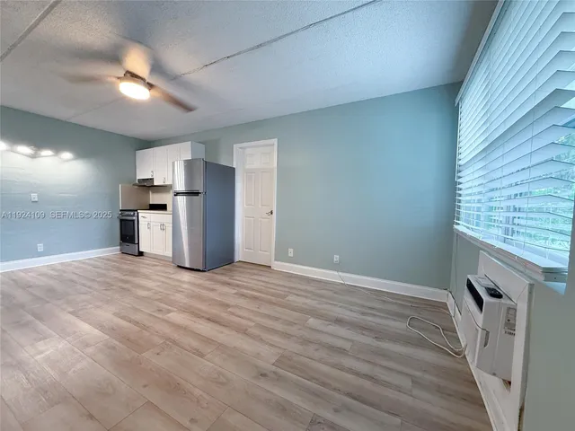 a view of a kitchen with a sink and a kitchen
