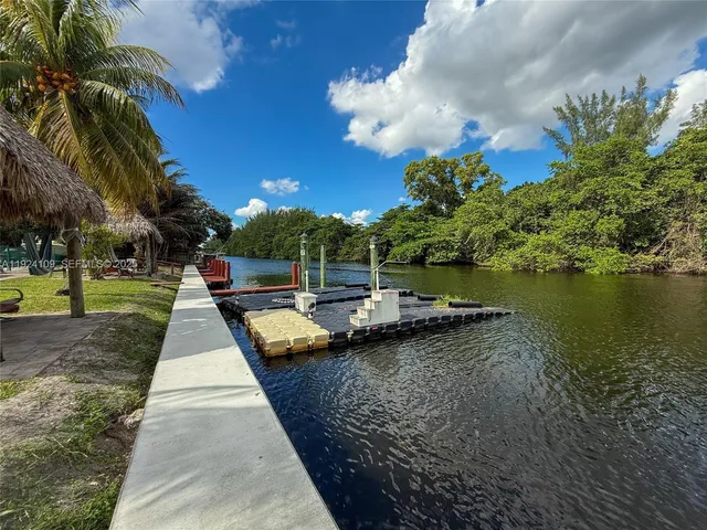 a view of a yard with swimming pool