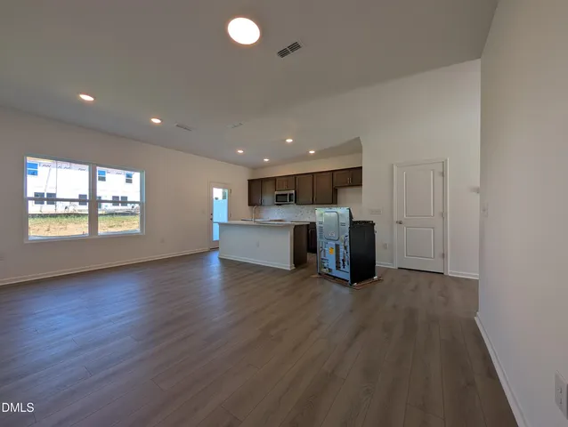 a view of a kitchen with a sink and a window