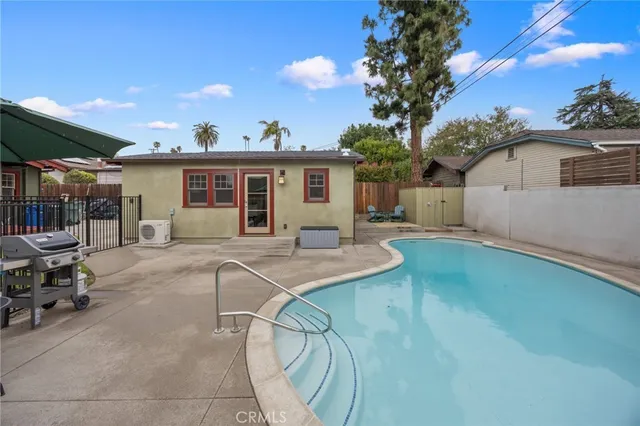 a view of a house with patio and a garden