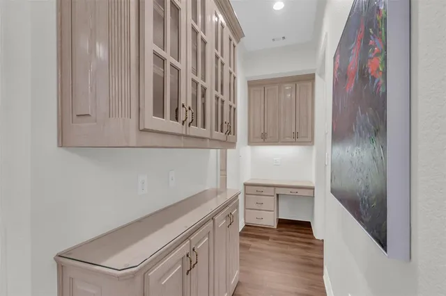 a hallway with cabinets