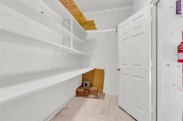 a view of a room with wooden floor and windows