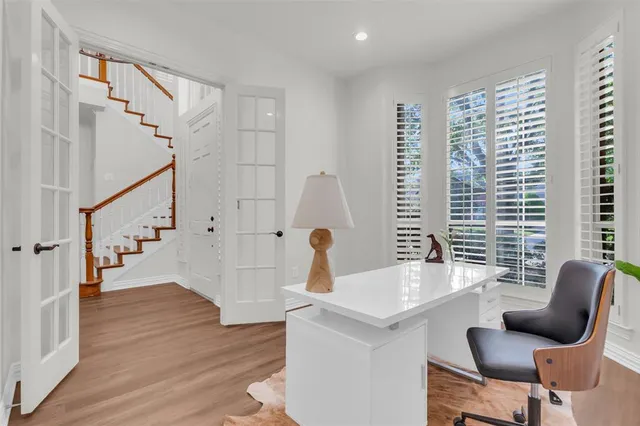 a view of living room with furniture and wooden floor